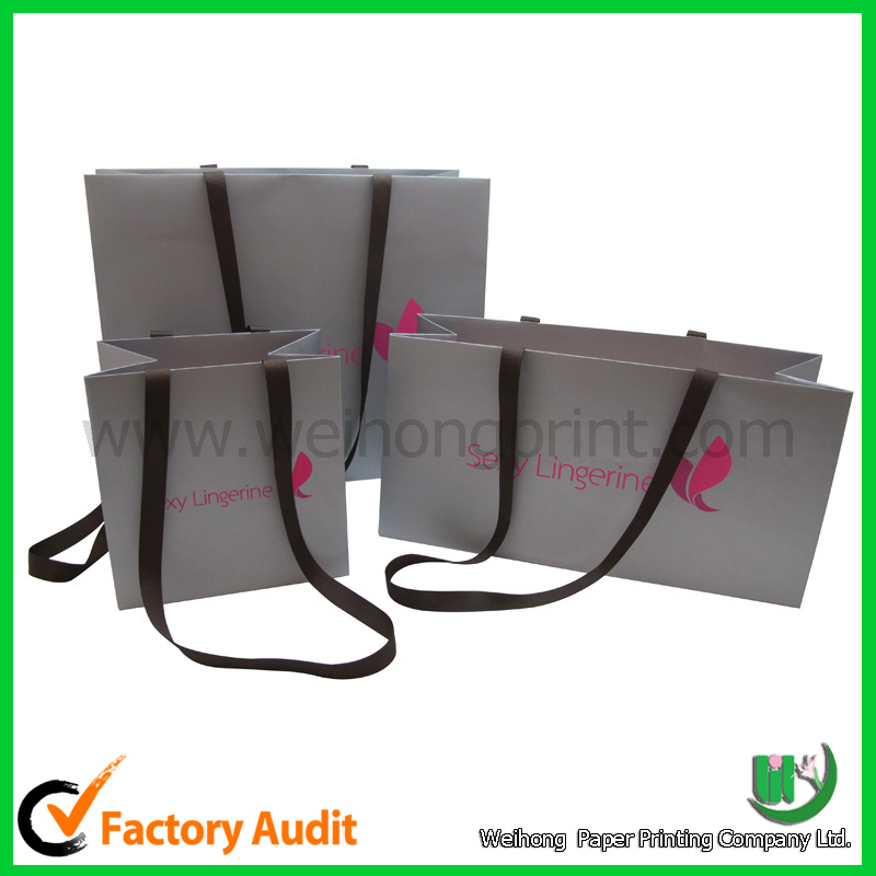 Shopping paper bag with ribbon handle